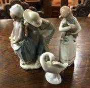 A group of three Lladro figures. Est. £20 - £30.