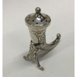 A Norwegian silver pepper in the form of a horn. Approx. 16 grams. Est. £30 - £50.