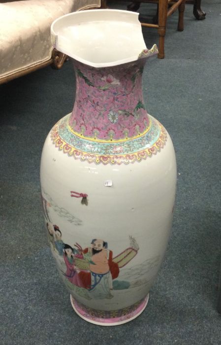 A tall Chinese vase decorated with figures in brig