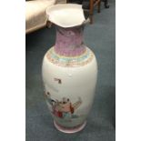 A tall Chinese vase decorated with figures in brig