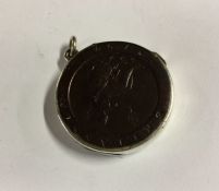 A silver vesta case in the shape of a coin. Approx