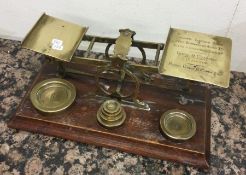 A large set of brass postal scales. Est. £30 - £40