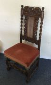 An oak Jacobean chair. Est. £20 - £30.