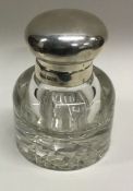 A heavy silver and glass inkwell. Sheffield 1918. By James Dixon and Sons. Est. £60 - £80.