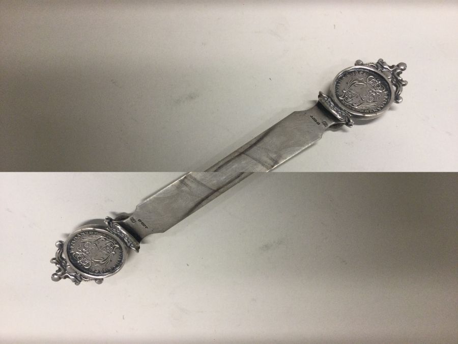 A silver letter opener inset with coin bearing import marks. Approx. 30 grams. Est. £25 - £35. - Image 2 of 2