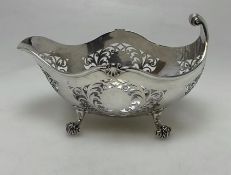 An unusual silver pierced basket with scroll decor