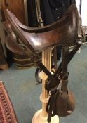 An American 12 inch leather Cavalry saddle dated 1