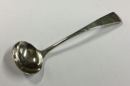 A Georgian silver cream ladle. London. by JL. Appr