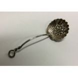 A heavy silver pierced sifter spoon with spiralled handle. Approx. 19 grams. Est. £20 - £30.