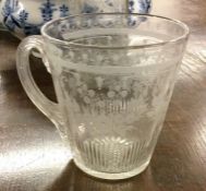A good etched glass tapering mug with fluted decor
