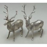 A heavy pair of cast silver figures of stags with