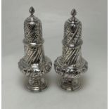 A good pair of Victorian silver sugar casters of h