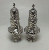 A good pair of Victorian silver sugar casters of h