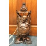 A Chinese hard wood figure of Buddha in the form o