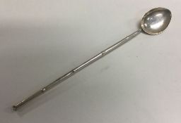 A large Chinese silver cocktail spoon with bamboo decoration. Approx. 10 grams. Est. £20 - £30.