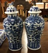 A tall pair of Chinese blue and white vases and co