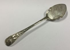 An unusual silver butter spoon. London. Approx. 36