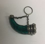 A Victorian green glass silver mounted horn shaped scent bottle and stopper. Approx. 14 grams.