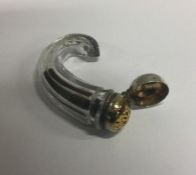 An early 19th Century horn shaped silver and glass vinaigrette. Approx. 32 grams. Est. £100 - £120.