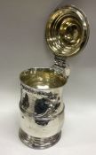 A George III silver lidded tankard with floral chased decoration. Possibly London 1786? By James