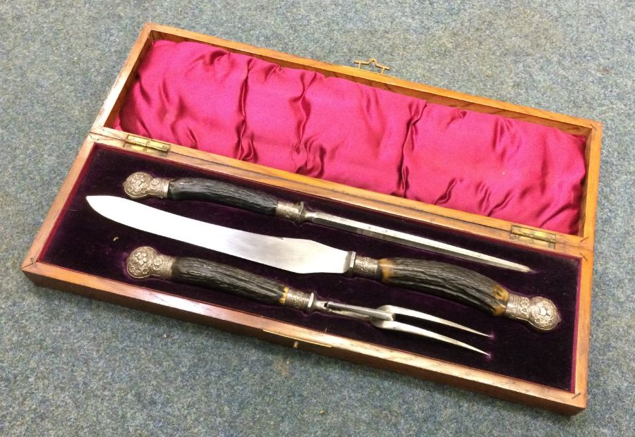 A silver handled three piece silver carving set. Sheffield 1923. By John Batt. Est. £80 - £120.