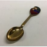 GEORG JENSEN: A heavy silver and enamel spoon. Approx. 46 grams. Est. £40 - £60.