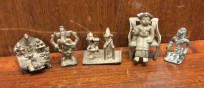 A group of five Antique brass figures on stands. E