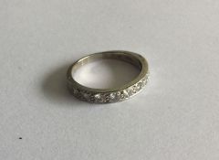 A good diamond half eternity ring set in 18 carat