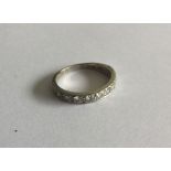 A good diamond half eternity ring set in 18 carat