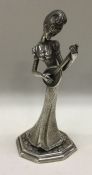 An import marked novelty silver figure of a lady playing guitar. By Mappin and Webb. Approx. 176