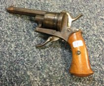 An old mahogany mounted steel pistol. Est. £30 - £
