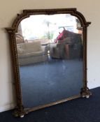 A large gild over mantle mirror. Est. £50 - £80.