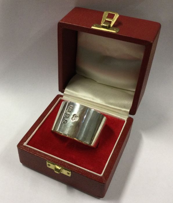 A heavy plain silver napkin ring in fitted box. Ap