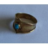 A Victorian 15 carat gold ring with central turquo