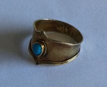 A Victorian 15 carat gold ring with central turquo