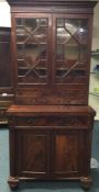 A Victorian mahogany two door bookcase. Est. £100