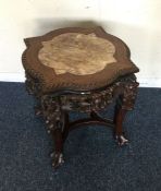 A Chinese plant stand with marble top. Est. £100 -