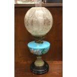 An antique glass oil lamp. Est. £60 - £80.