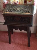 A small carved letter box on stand. Est. £30 - £40