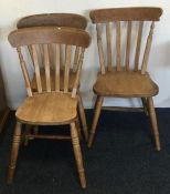 A set of three pine stick back chairs. Est. £20 -