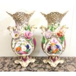 A good pair of Victorian porcelain vases decorated