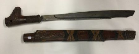 A good Antique tribal knife with carved handle and