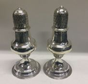 A pair of silver George III silver casters. London 1790. By George Giles. Approx. 150 grams. Est. £