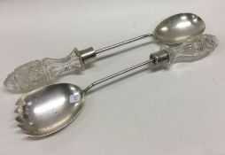 A pair of silver and glass servers. Approx. 255 grams. Est. £80 - £120.