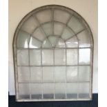 A large glass panelled window. Est. £60 - £80.