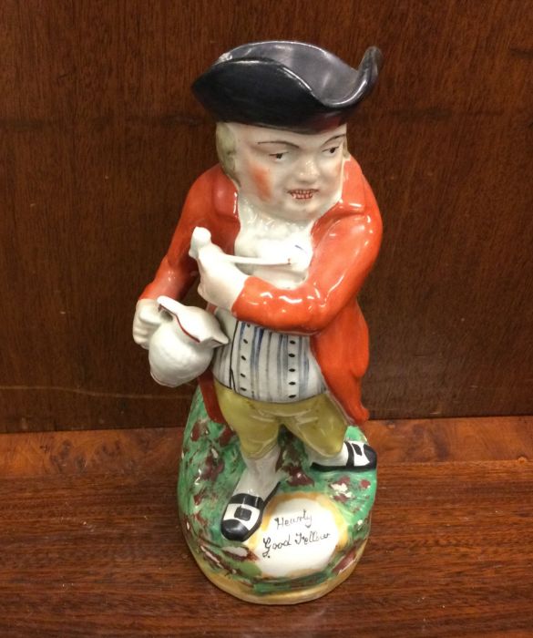 An Antique pottery Toby jug. Est. £20 - £30.