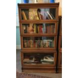 A four section oak Globe Wernicke bookcase. Est. £