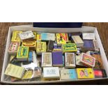 A box containing old matchboxes. Est. £10 - £20.