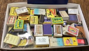 A box containing old matchboxes. Est. £10 - £20.