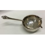 A silver tea strainer on stand. Birmingham 1961. By JB Chatterley and Sons Ltd. Approx. 80 grams.